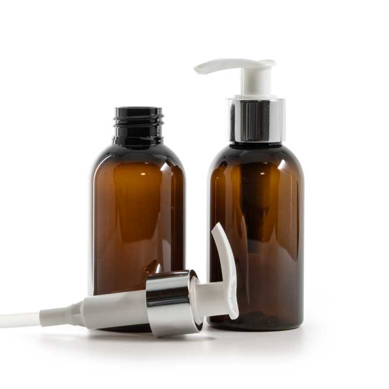 Flacone di plastica ambra, pompa bianca con anello argento lucido, 100 ml