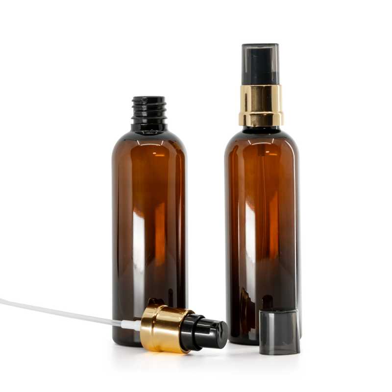 Flacone di plastica marrone, pompa nero-oro lucida con sopra-tappo fumé, 100 ml