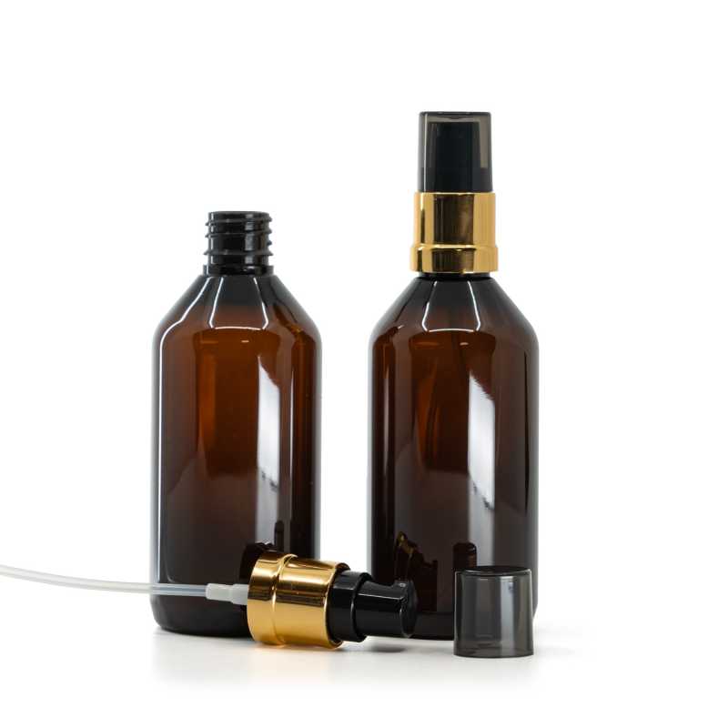 Bottiglia di plastica marrone, dosatore nero-oro lucido con sopra-tappo fumé, 115 ml