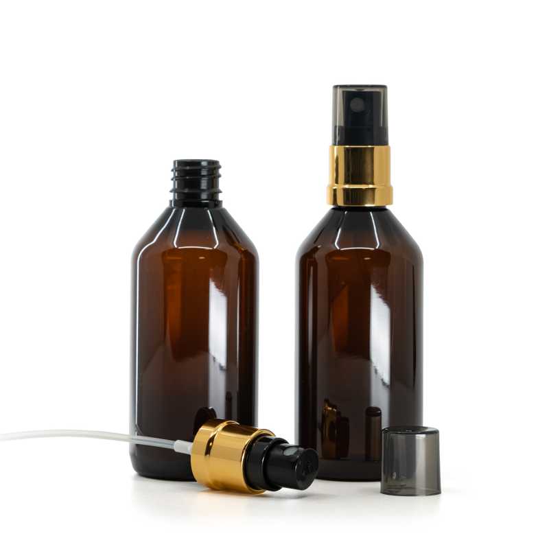 Bottiglia di plastica marrone, spruzzatore nero e oro, sopra-tappo fumé, 115 ml