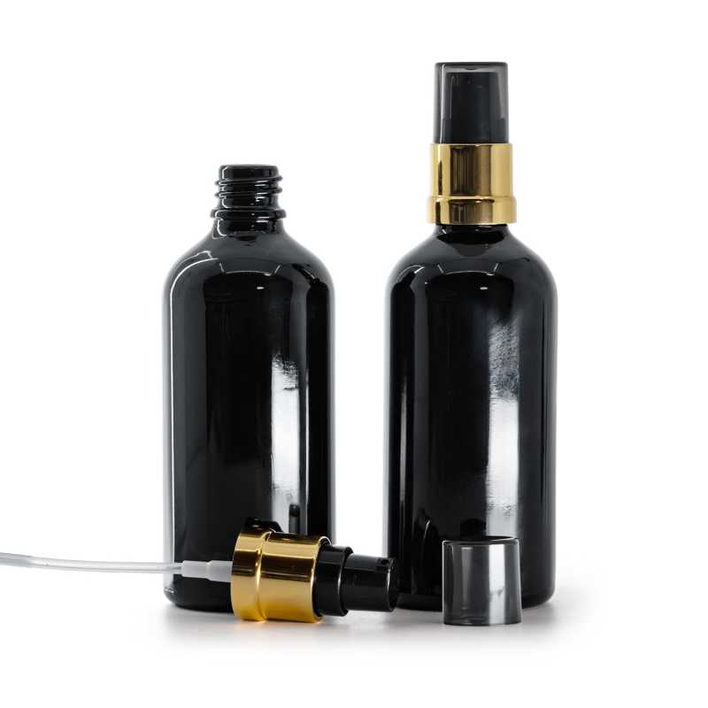 Flacone di vetro nero lucido, pompa nera e dorata lucida con sopra-tappo fumé, 100 ml