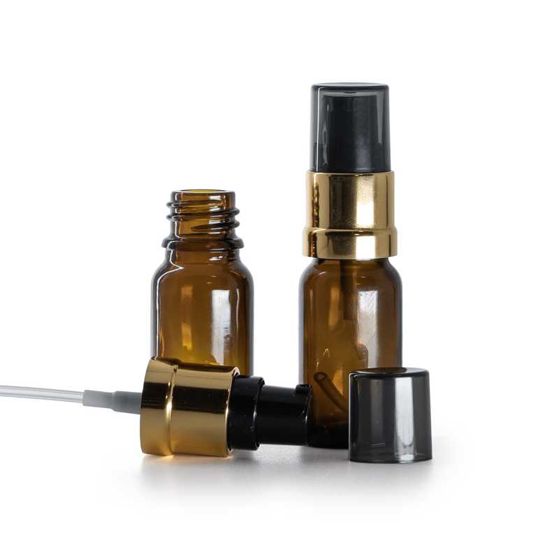 Flaconcino di vetro ambra, pompa nera e oro lucida con sopra-tappo fumé, 10 ml