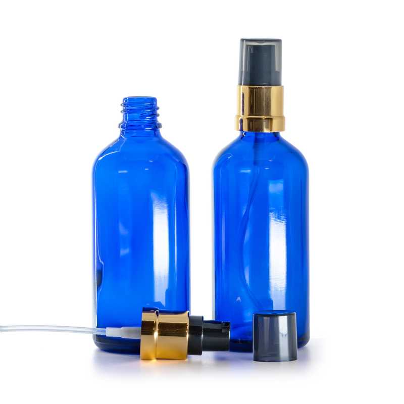 Flacone di vetro blu, dosatore nero e dorato lucido con sopra-tappo fumé, 100 ml