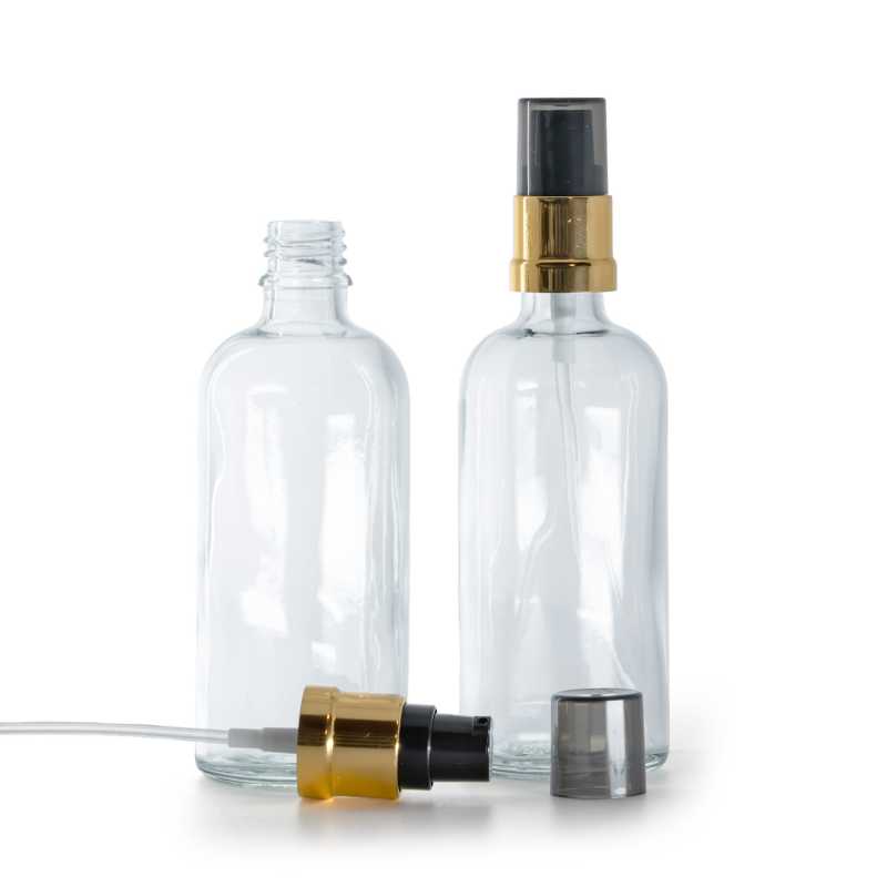 Flacone di vetro trasparente, pompa nera e dorata lucida con sopra-tappo fumé, 100 ml