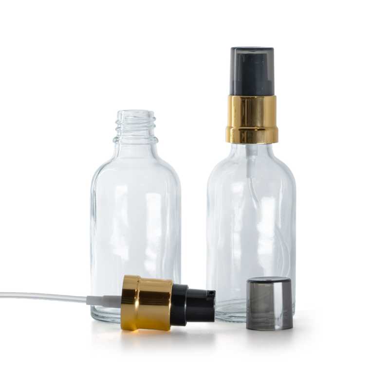 Flacone di vetro trasparente, pompa lucida nero-oro con sopra-tappo fumé, 30 ml