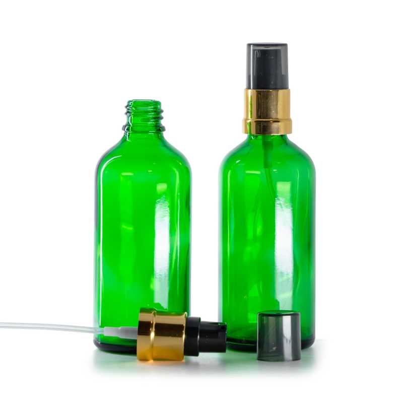 Flacone di vetro verde, dosatore nero e dorato lucido con sopra-tappo fumé, 100 ml
