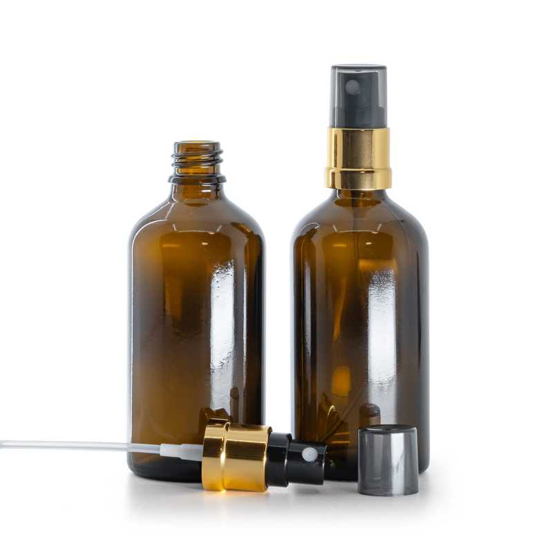 Bottiglia di vetro ambra, spruzzatore nero e dorato, sopra-tappo fumé, 100 ml